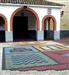 Plaza de San Bartolome. Puerta de la iglesia, con el escudo del pueblo en el suelo.