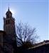 La torre de la Colegiata con el sol detrás (foto: JLSL)