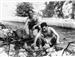 Luis y Nacho asando una pata de cordero al pie de la canal en la Senda del Cares. Año 1958.
