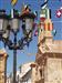 Portada y Campanario de la Capilla del Convento junto a una de las farolas que rodean la plaza,adorn